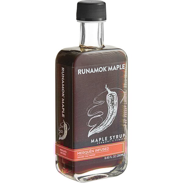 A bottle of Runamok Merquen Smoked Chili Pepper-Infused Maple Syrup with a black cap.