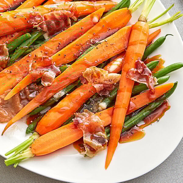 A plate of carrots and green beans with Runamok Merquen Smoked Chili Pepper-Infused Maple Syrup.