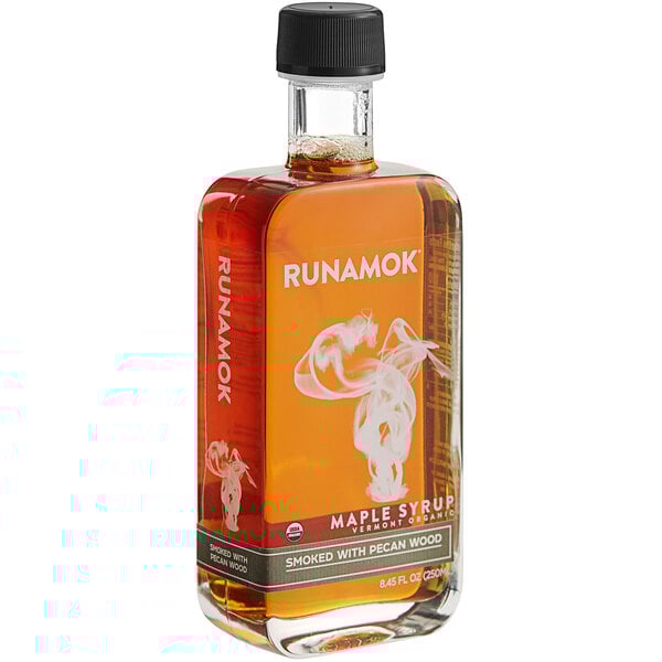 A bottle of Runamok maple syrup with smoke inside.