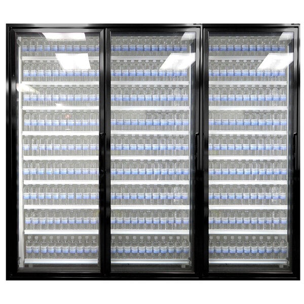 A Styleline walk-in freezer merchandiser door with shelving filled with bottles of water.