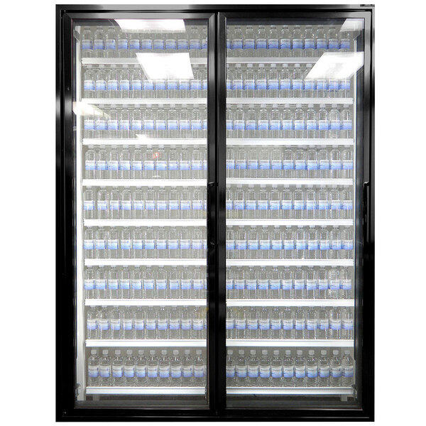 A Styleline walk-in freezer merchandiser door with glass doors holding water bottles.