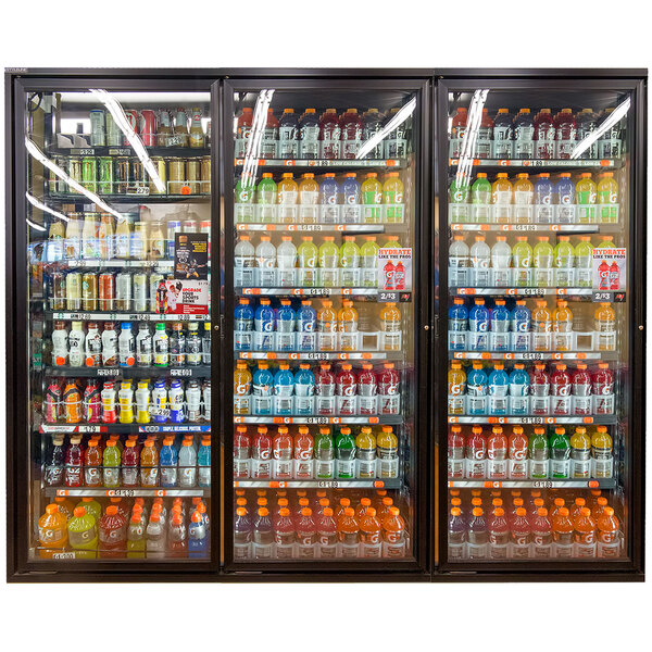 A Styleline walk-in cooler merchandiser door with shelves filled with drinks.