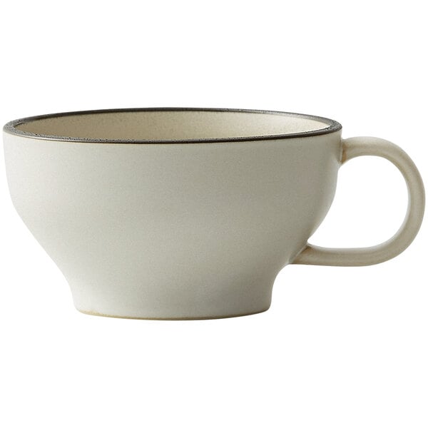 A close-up of a white Oneida Moira stoneware cup with a handle.