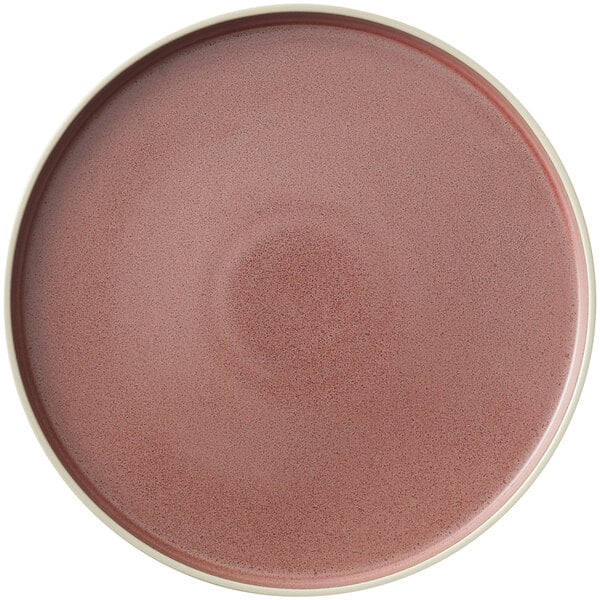 A smoky plum stoneware plate with a white rim.