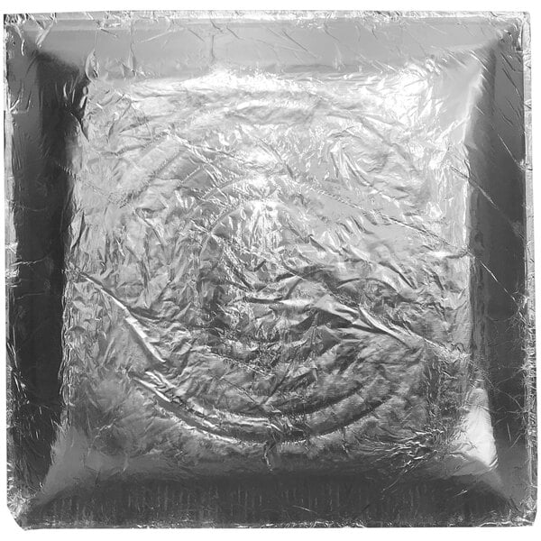A square of silver foil with a square design.