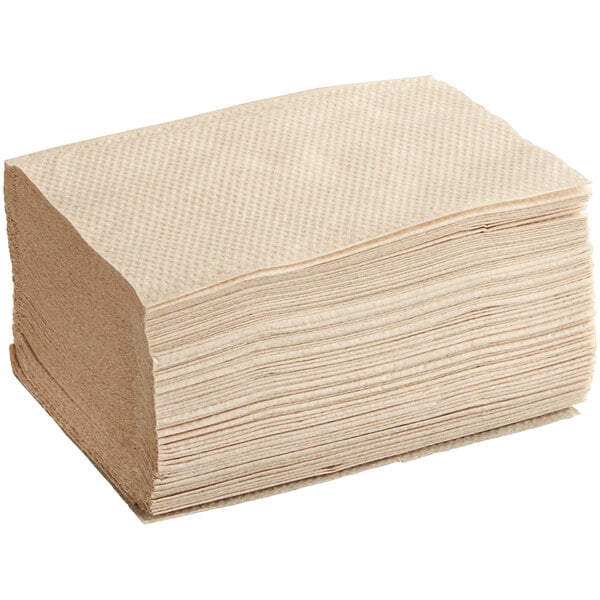 A large stack of beige OneUp by Choice Kraft dispenser napkins.