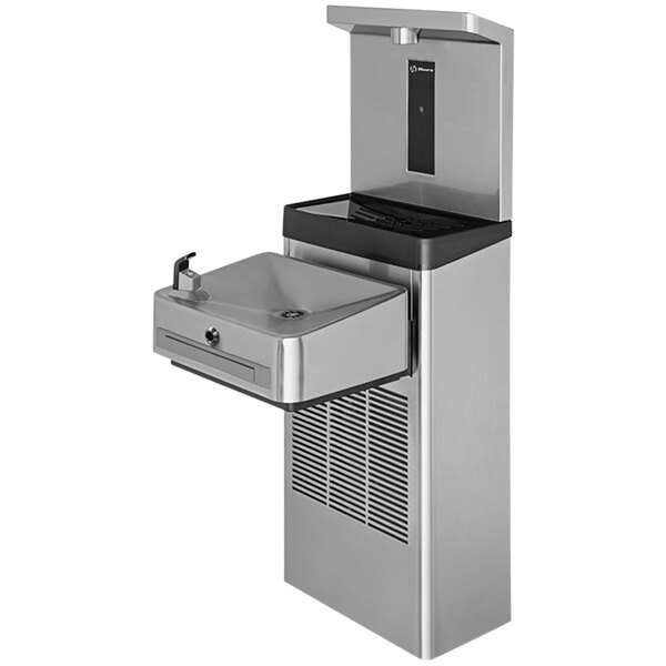 A Haws stainless steel wall mount touchless water cooler and bottle filler over a water fountain.