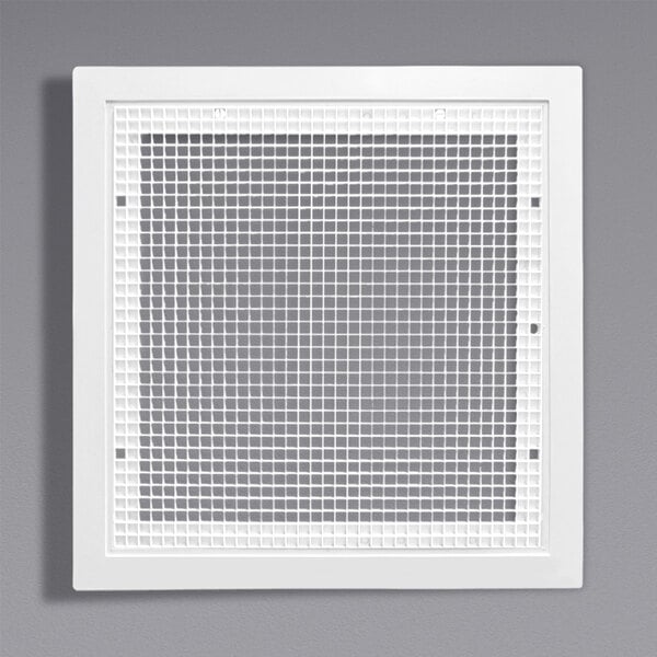 A white square vent grille with a grid.