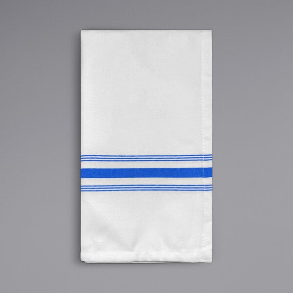 A white cloth napkin with blue stripes.