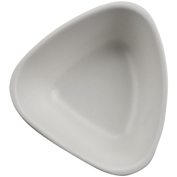 A white triangular cheforward ramekin.