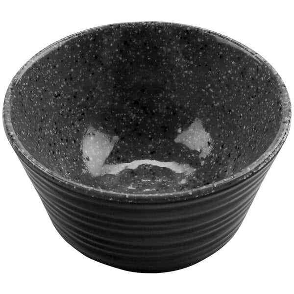 A stone grey melamine ramekin with a speckled design.