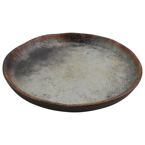 A cheforward melamine plate with a black and white woven design.