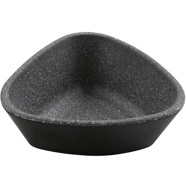 A black bowl with a grey and speckled ramekin inside.