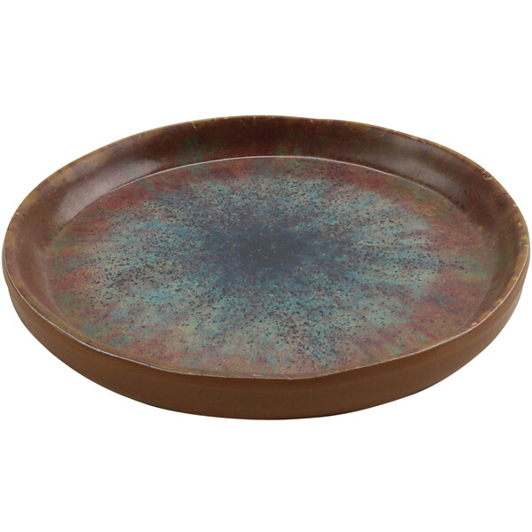 A round brown cheforward melamine plate with blue specks.