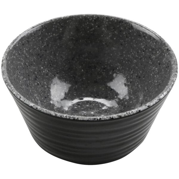 A black ramekin with a gray speckled design.