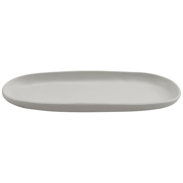 A white oval cheforward melamine platter with a small handle.