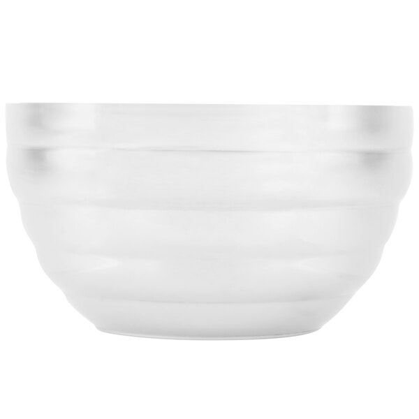 A white Vollrath beehive serving bowl.