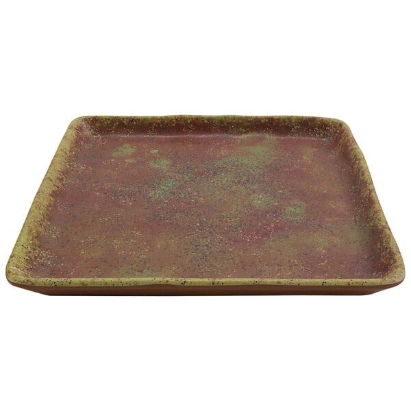 A cheforward square azul iris melamine plate with a green speckled surface.