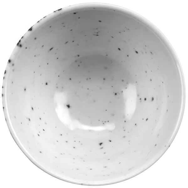 A white cheforward stone ramekin with black specks.