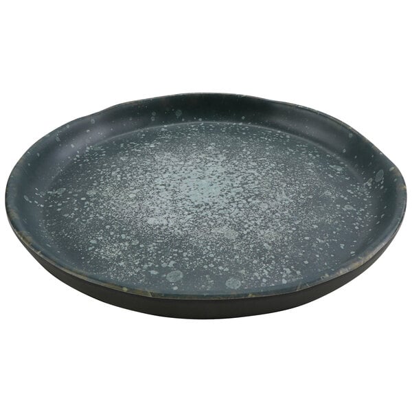 A black cheforward by GET round melamine plate with white specks on it.