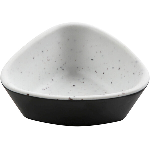 A white and black speckled cheforward ramekin.