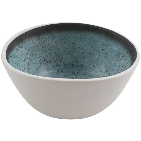 A white cheforward melamine bowl with blue specks.