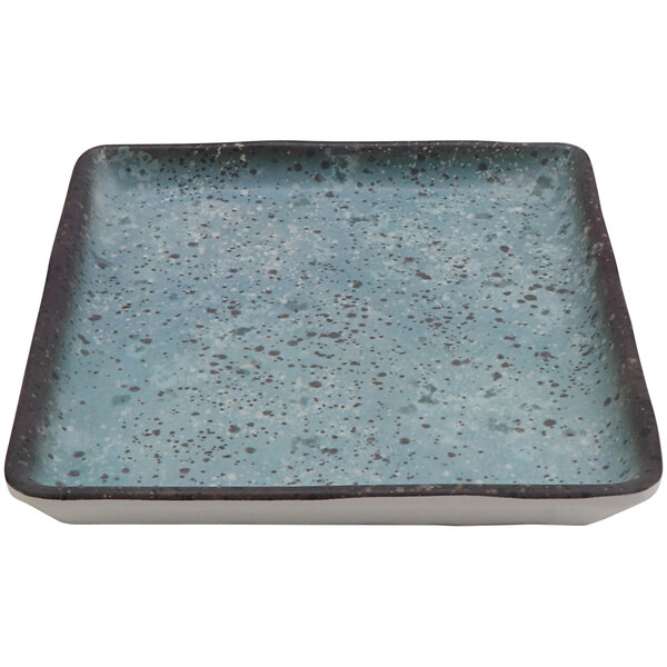 A close-up of a cheforward square robin's egg blue melamine plate with speckled specks.
