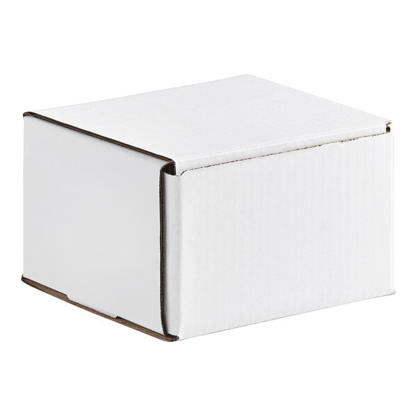 A small white corrugated mailer box with a tuck top design.