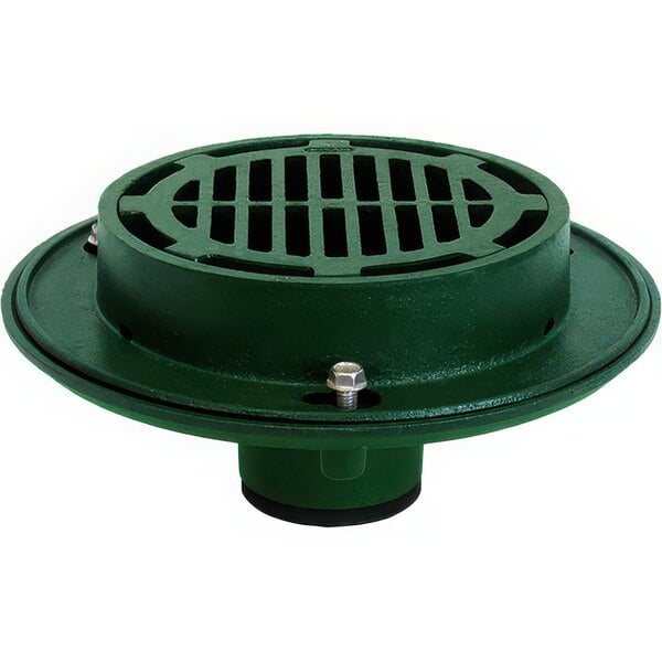 A green metal drain with a round base and a green cast iron grate.