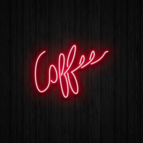 A Canvas Freaks neon sign with the word "coffee" in red on a black background.