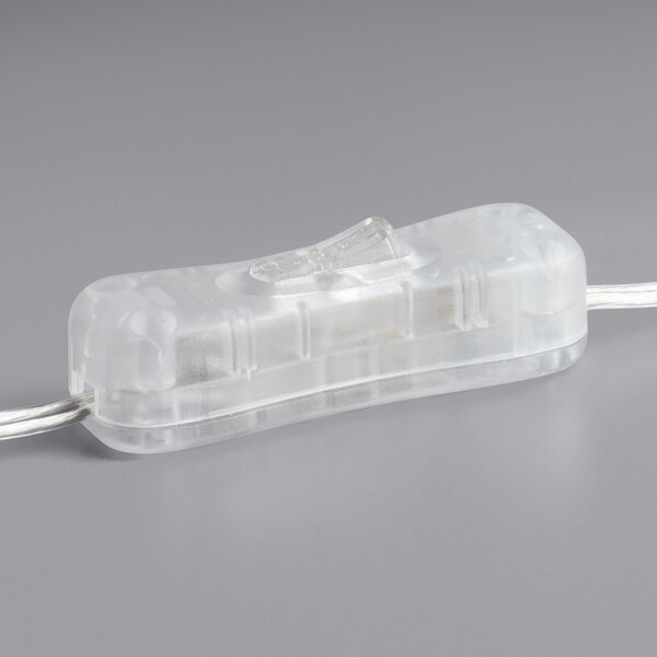 A close up of a clear plastic neon light shaped like a pizza slice with a wire attached.