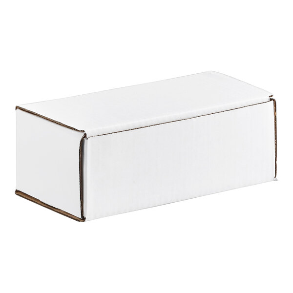 A white corrugated mailer box with tuck top, measuring 6 1/2 by 3 5/8 by 2 1/2 inches.
