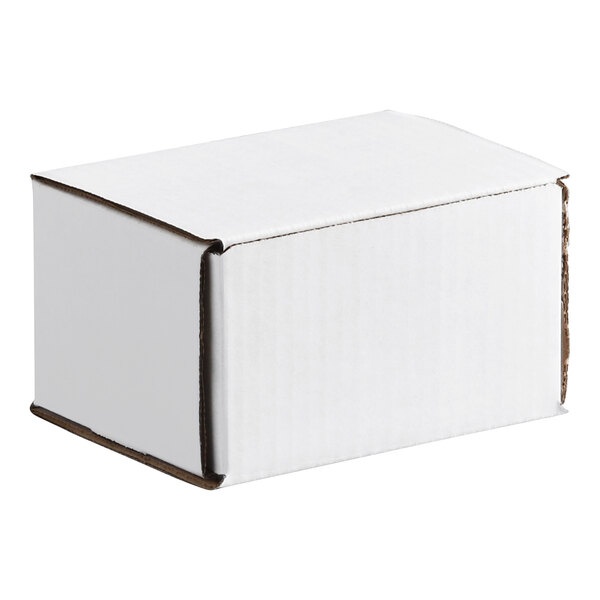 A small white corrugated mailer box with a tuck top design.