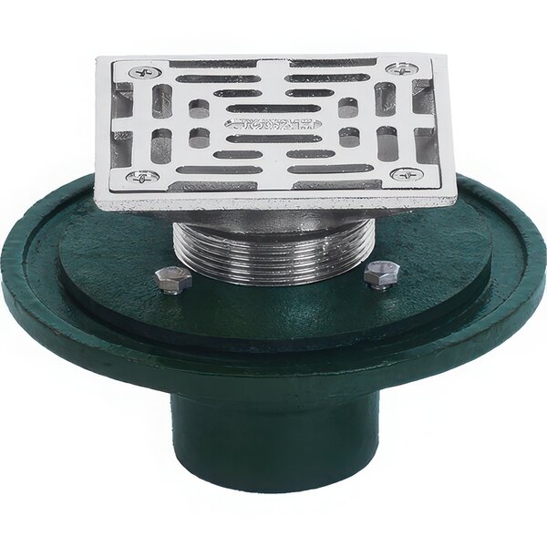 A green and silver square Josam floor drain with a metal plate with holes.