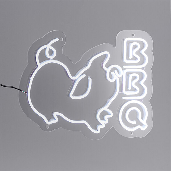 A Canvas Freaks neon sign with the word "BBQ" in white neon on a white background.