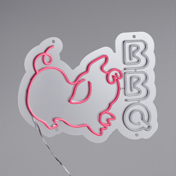 A white neon sign of the word "BBQ" with pink neon lights.