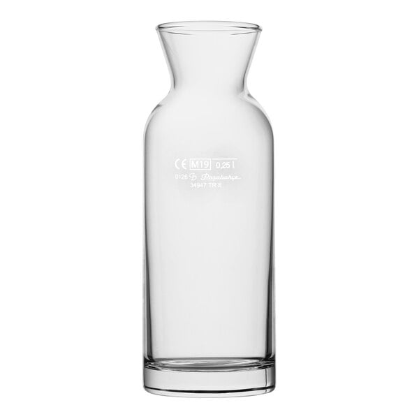 A clear glass carafe with a narrow neck and an 8.45 oz. fill line, designed for serving beverages.