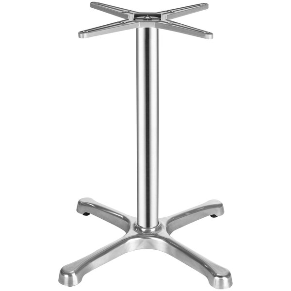 A silver FLAT Tech aluminum table base on a table.