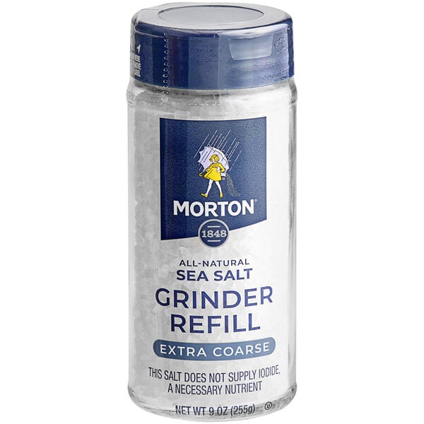 A Morton Extra Coarse Sea Salt Grinder bottle on a counter.