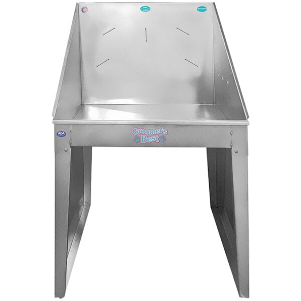 A silver stainless steel Groomer's Best dog bathing tub with a blue seat.