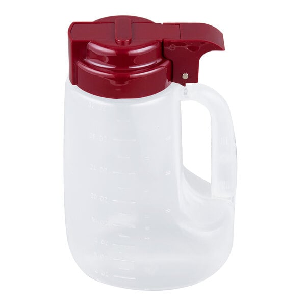 A clear 32 oz. dispenser jar with a maroon top and handle.