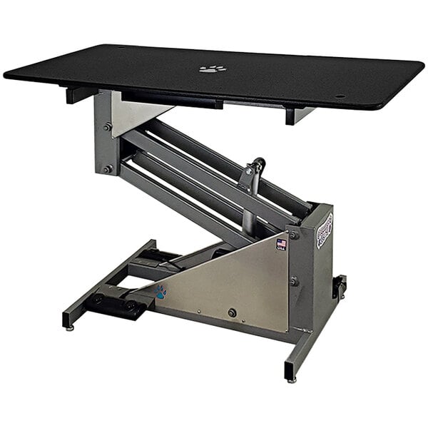A black Groomer's Best grooming table with a silver frame.