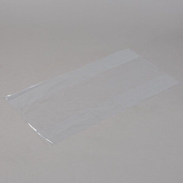 A clear plastic bag on a white surface.