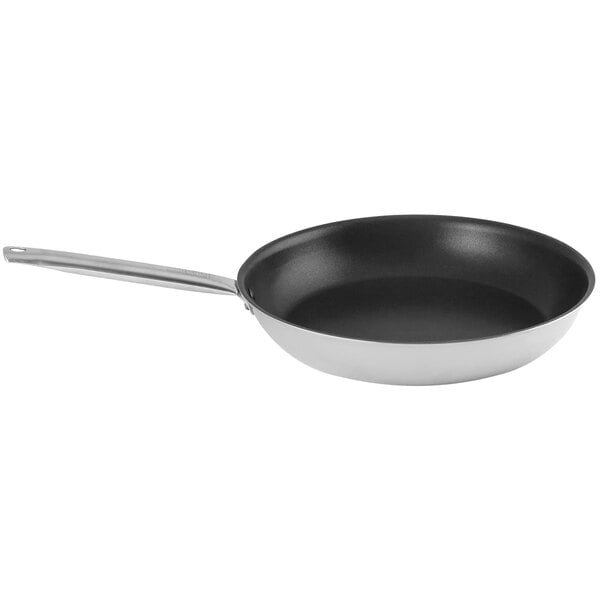 A close-up of a Spring USA Vulcano 5-ply non-stick fry pan with a stainless steel handle.