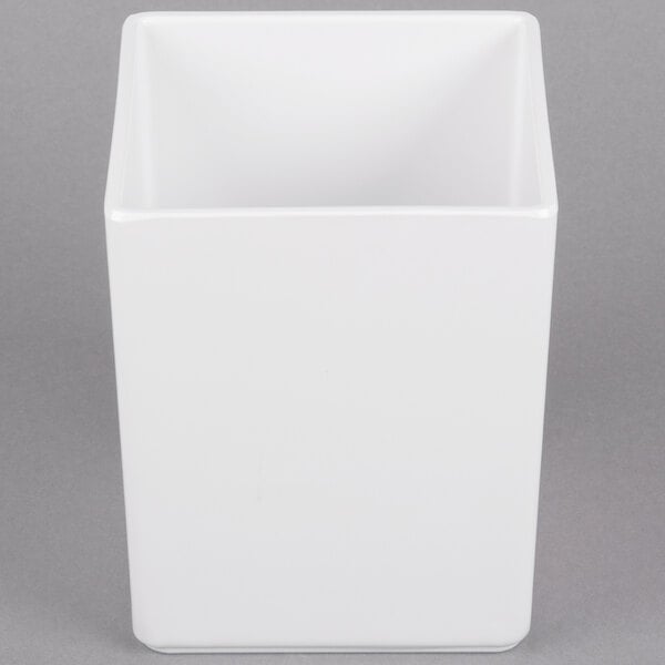 A white square container with a white lid.