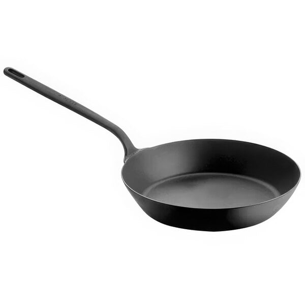 A Spring USA Black carbon steel fry pan with a black handle.