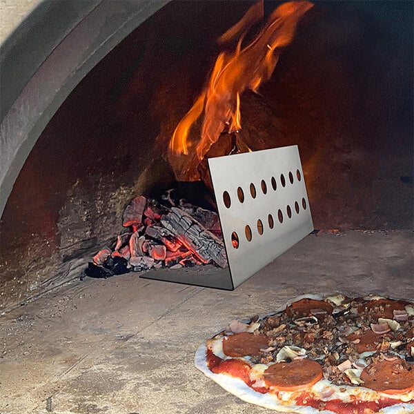 The inside of a wood-burning outdoor pizza oven