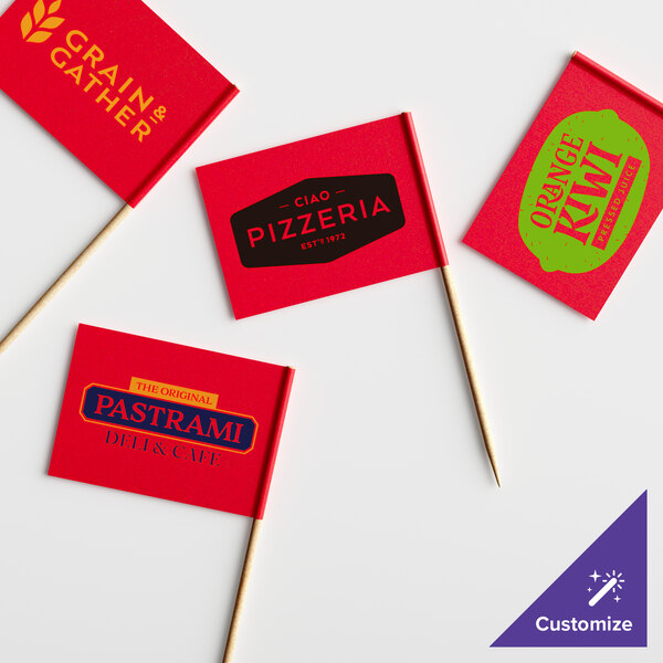 A group of red rectangular small flags with yellow text on them.