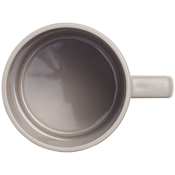 An American Metalcraft Unity beige Tritan coffee mug with a handle.