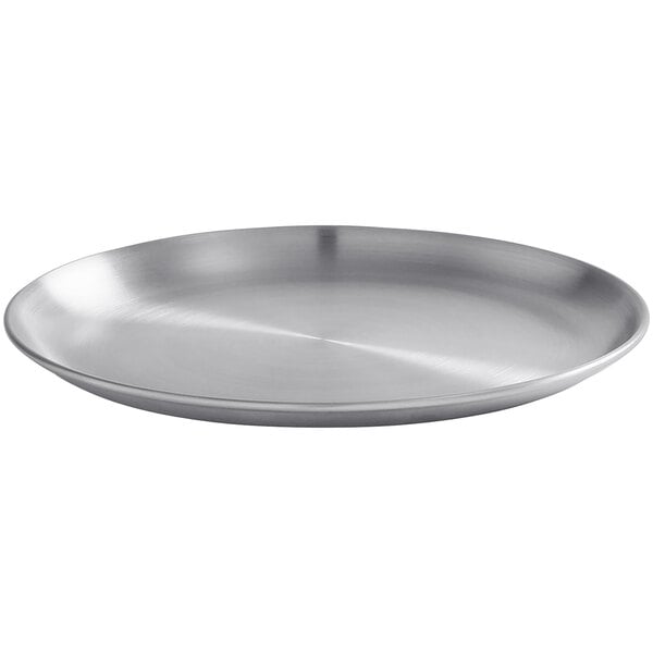 An American Metalcraft satin stainless steel plate with a circular design.